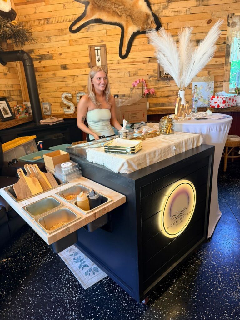 Kerri behind the Moon Water cannoli bar cart